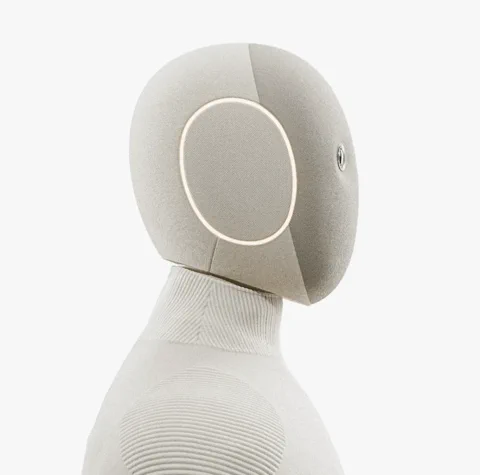 1X's humanoid robot companion providing assistance to an elderly person